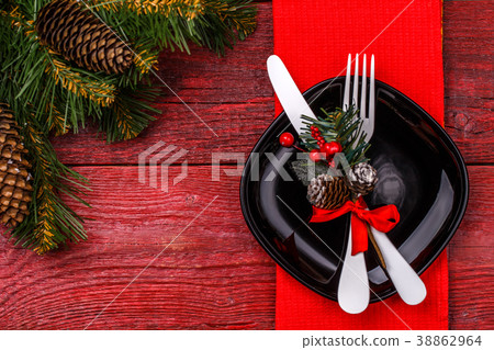 Christmas table place setting with red napkin Christmas table place setting with red napkin 38862964