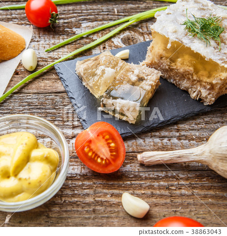 Homemade jelly meat with mustard, bread, tomatoes Homemade jelly meat with mustard, bread, tomatoes 38863043