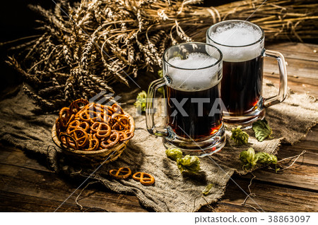 Two tankard beer with wheat and hops , basket of Two tankard beer with wheat and hops , basket of 38863097