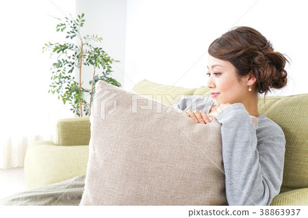A woman living alone relaxing at home A woman living alone relaxing at home 38863937