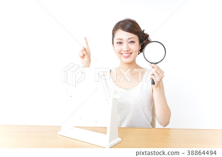 Skin care and magnifying glass Skin care and magnifying glass 38864494