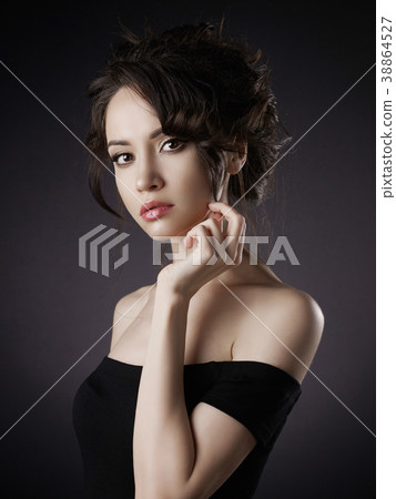 Beautiful woman with elegant hairstyle on black background Beautiful woman with elegant hairstyle on black background 38864527