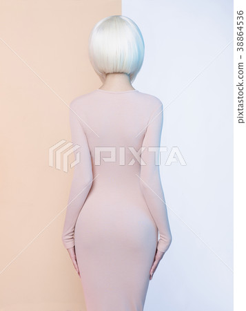 Elegant blonde in geometric beige and white background Elegant blonde in geometric beige and white background 38864536