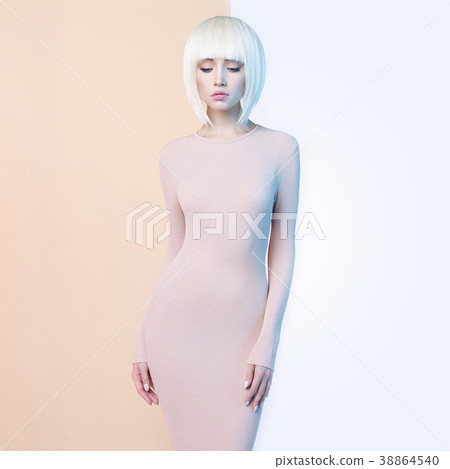 Elegant blonde in geometric beige and white background Elegant blonde in geometric beige and white background 38864540