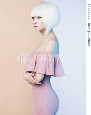 Elegant blonde in geometric beige and white background Elegant blonde in geometric beige and white background 38864541
