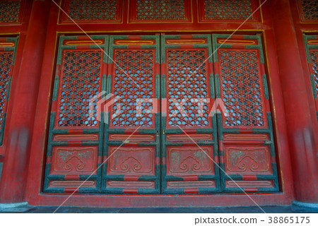 Ornate red wooden door Ornate red wooden door 38865175