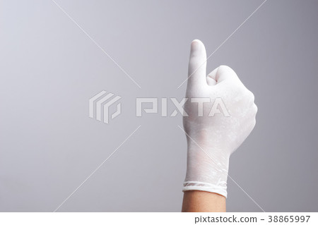 Hand wearing latex glove with thumb up gesture Hand wearing latex glove with thumb up gesture 38865997