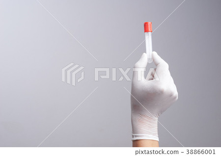 Hand with latex glove holding empty test tube Hand with latex glove holding empty test tube 38866001