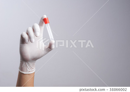 Hand with latex glove holding empty test tube Hand with latex glove holding empty test tube 38866002