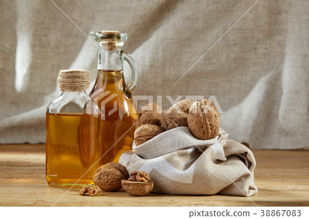 Aromatic oil in a glass jar and bottle with Aromatic oil in a glass jar and bottle with 38867083