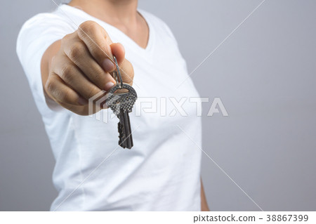 Woman hand giving keys 38867399