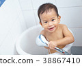 Asian baby take a shower by himself 38867410