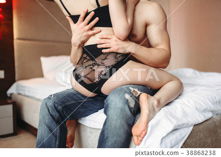 Lovers in underwear hugging in bed, intimate games 38868238