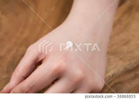 teen girl applying hand cream 38868855