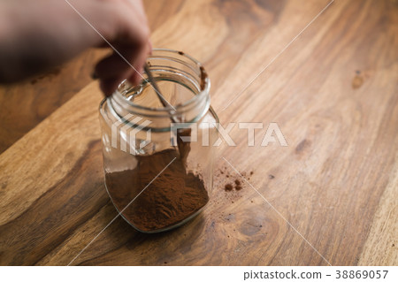 making cocoa drink in glass jar with handle on making cocoa drink in glass jar with handle on 38869057