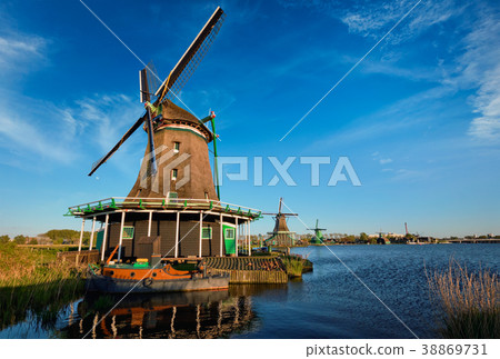 Windmills at Zaanse Schans in Holland on sunset Windmills at Zaanse Schans in Holland on sunset 38869731