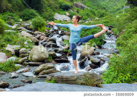 Woman doing Ashtanga Vinyasa Yoga asana outdoors 38869809