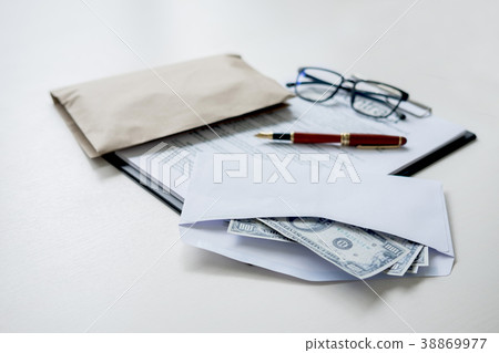 Bribery and corruption concept, bribe in the form of dollar bill Bribery and corruption concept, bribe in the form of dollar bill 38869977