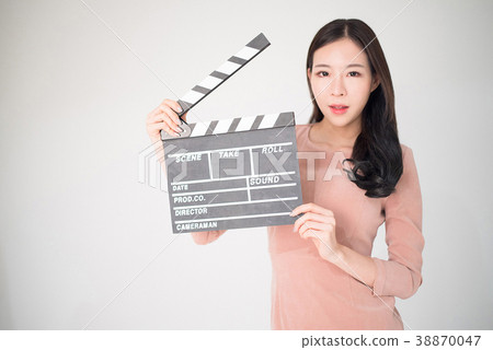 sian woman holding movie clapper board on white sian woman holding movie clapper board on white 38870047