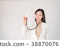 Asian woman female doctor holding sthetoscope 38870076