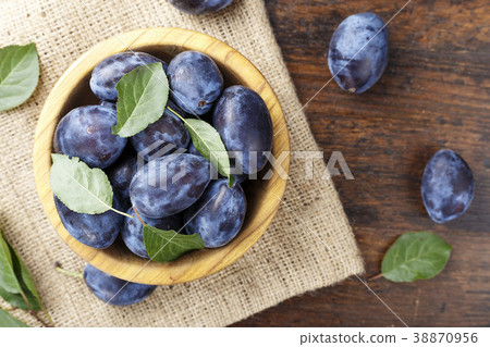 ripe plums in a plate 38870956
