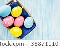 Easter eggs in the basket on rustic background 38871110