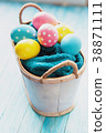 Easter eggs in the basket on rustic background 38871111