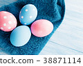Pastel color Easter eggs on rustic background 38871114