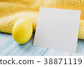 Blue and yellow Easter eggs on rustic background 38871119