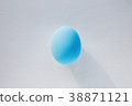 Blue Easter egg on white paper sheet background 38871121