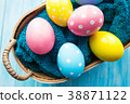 Easter eggs in the basket on rustic background 38871122