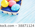 Easter eggs in the basket on rustic background 38871124