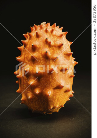 kiwano fruit in dramatic light 38872956