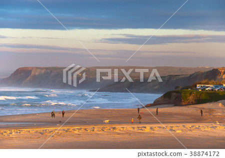 People walking ocean beach Portugal 38874172