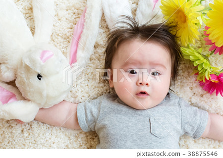 Baby boy with a rabbit celebrating Easter 38875546