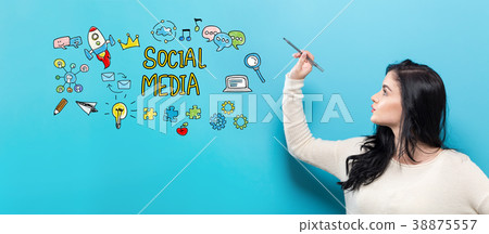 Social Media with young woman holding a pen 38875557