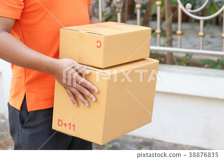 Delivery man with parcel. Delivery man with parcel. 38876835