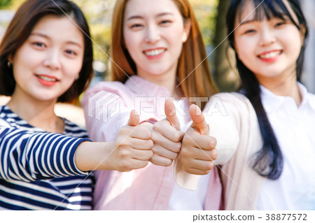 Campus life - freshmen enjoy theirs the campus life. young college students walking on around of campus. 220 38877572