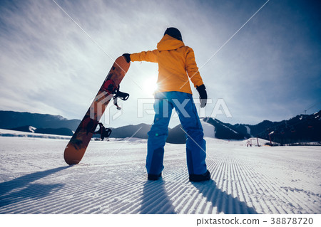 snowboarder at snowobard piste on winter mountains snowboarder at snowobard piste on winter mountains 38878720