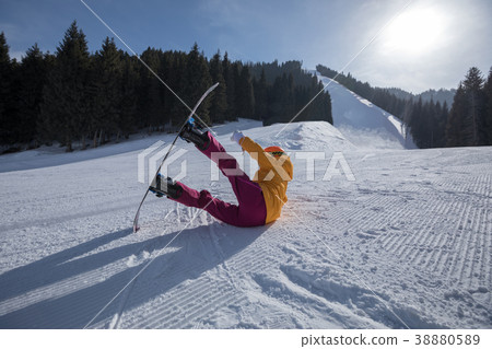 one young woman snowboarding in winter mountains 38880589