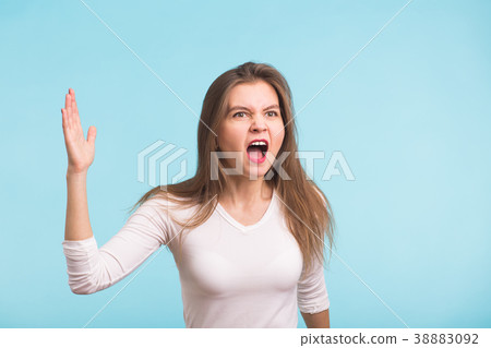Angry aggressive woman screams Angry aggressive woman screams 38883092