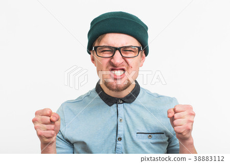 Angry aggressive man with ferocious expression Angry aggressive man with ferocious expression 38883112