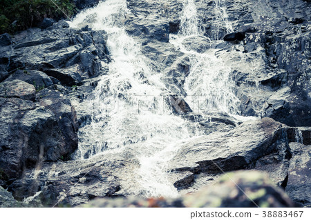 Mountain waterfall on a summer day 38883467