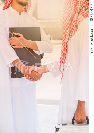 Muslim business handshake for achievement 38884479