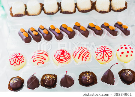 Delicious sweets on wedding candy buffet with 38884961