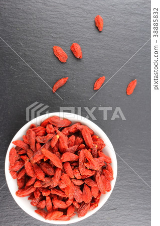 dried goji berries in a small white bowl dried goji berries in a small white bowl 38885832