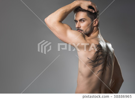 Serious beefy guy posing naked 38886965