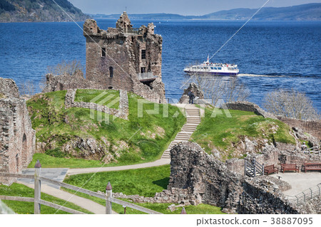 Urquhart Castle with boat on Loch Ness in Scotland 38887095