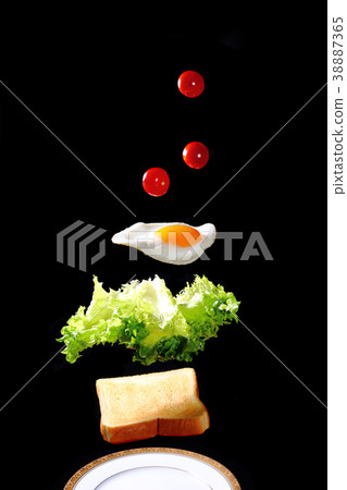 Fried egg toast floating in the air 38887365