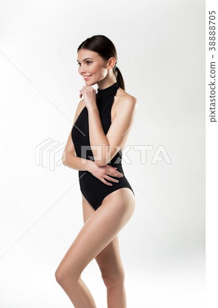 Attractive girl standing in black underwear 38888705